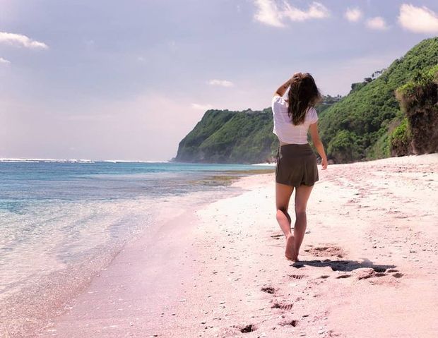 Walking down a pristine beach in the south of Bali