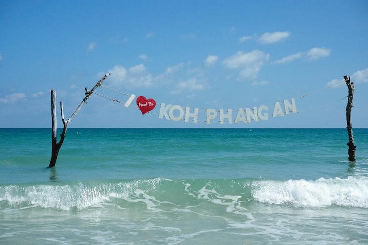 Shot of a swing over the water that says